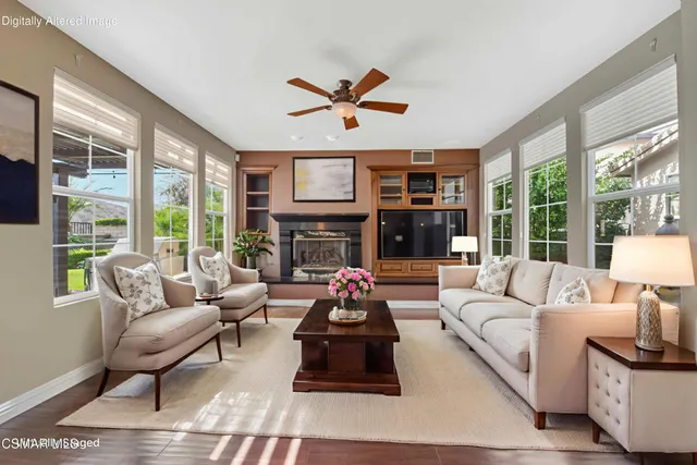 a view of kitchen with furniture and a refrigerator