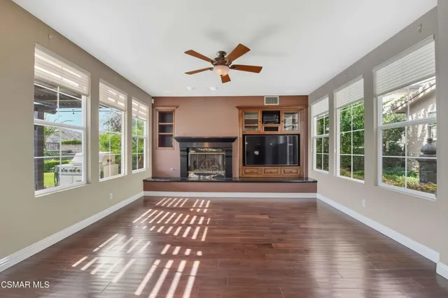 a view of a dining room with furniture and window