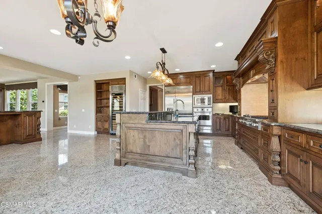 a bathroom with a sink mirror and toilet