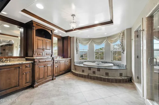 a view of a livingroom with wooden floor and a ceiling fan