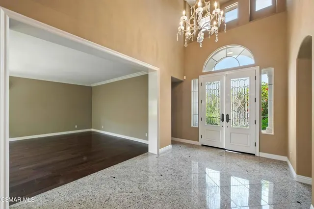 a view of an entryway with wooden floor and windows