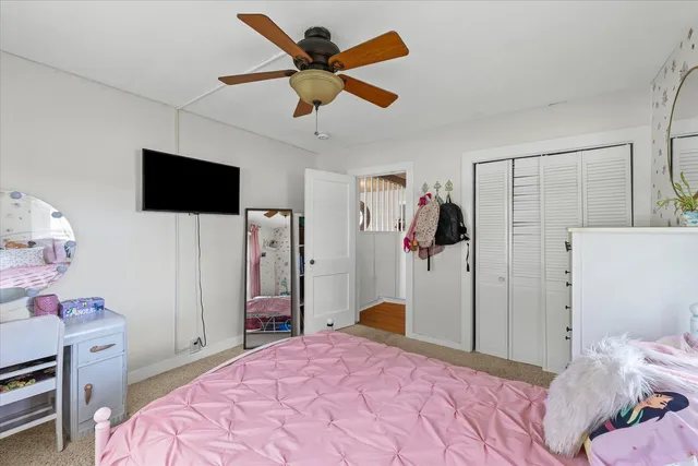 a view of livingroom with hardwood floor and ceiling fan
