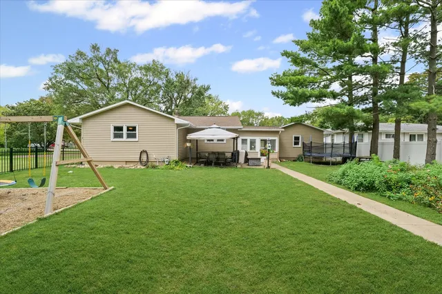 a view of a patio with table and chairs and potted plants