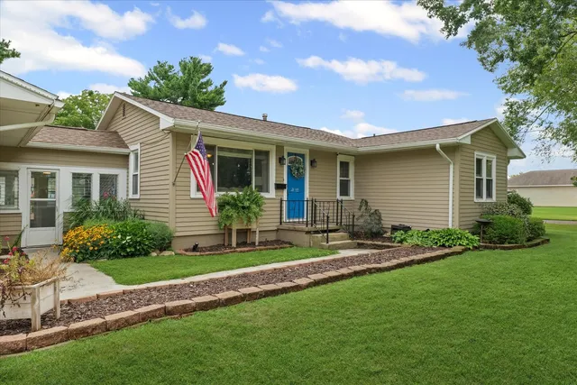 a front view of house with yard and green space