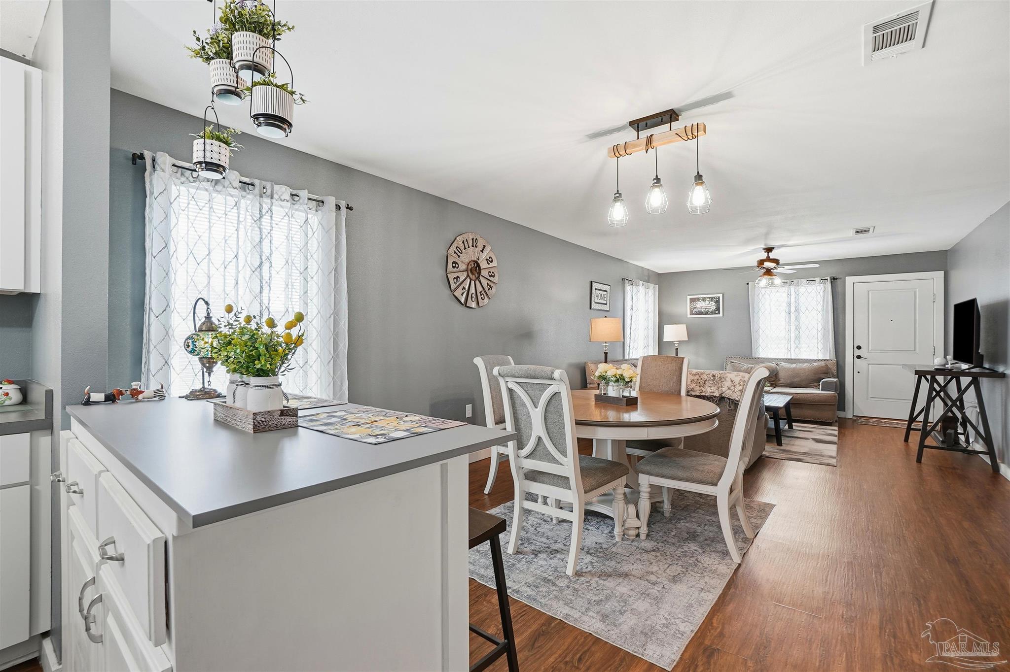 402 Front Street Century, FL 32535 - Photo 13 of 48 a view of a dining room with furniture and wooden floor