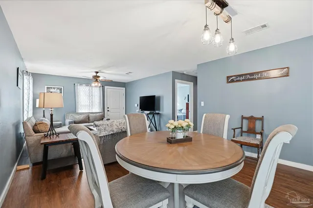 a view of a dining room with furniture