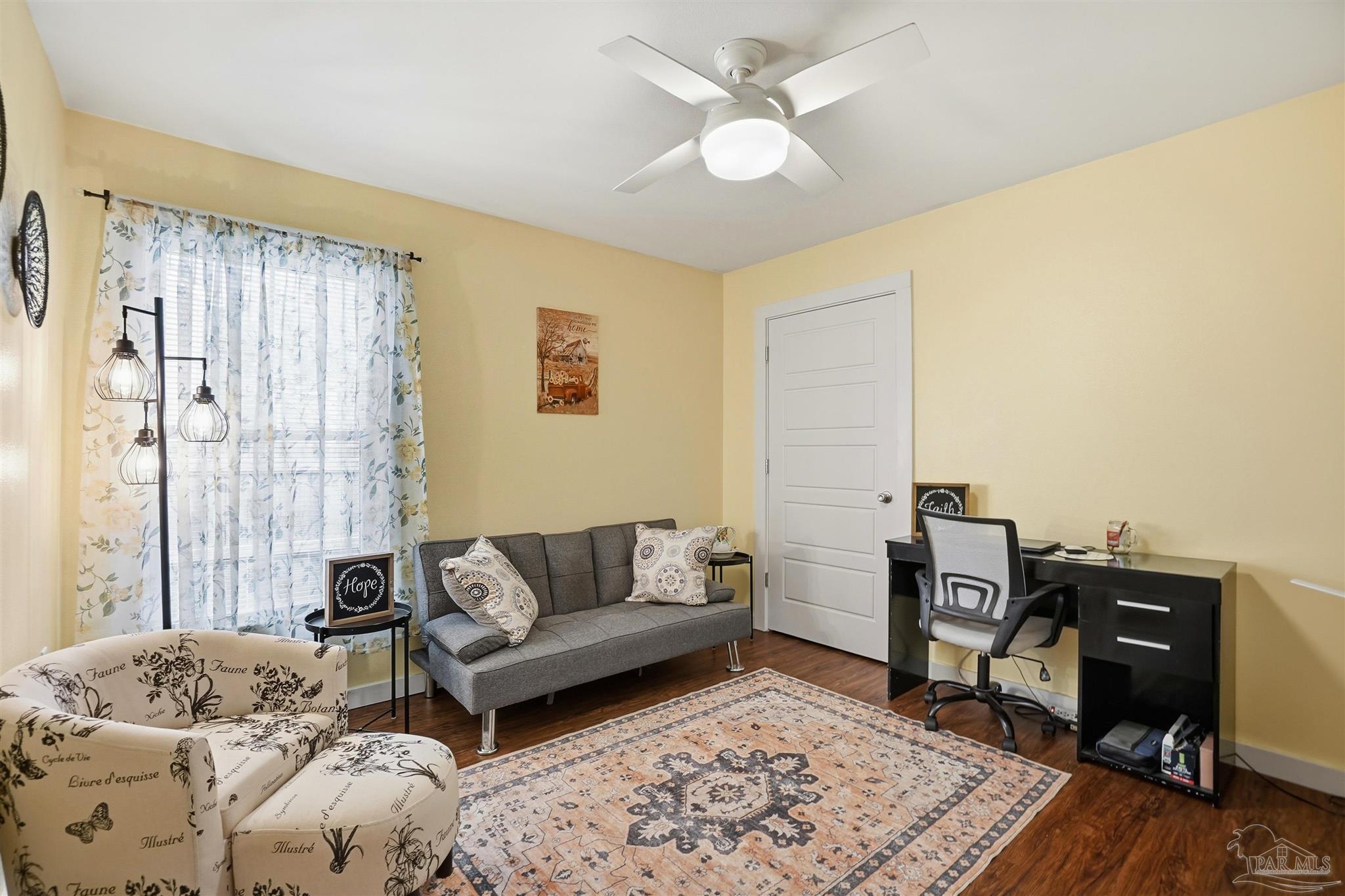 402 Front Street Century, FL 32535 - Photo 16 of 48 a living room with furniture and a wooden floor