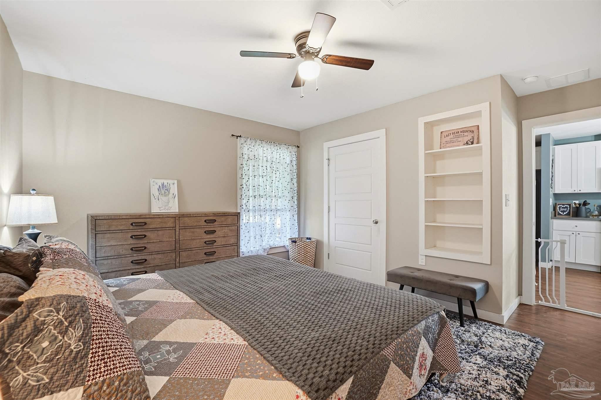 402 Front Street Century, FL 32535 - Photo 21 of 48 a bedroom with a large bed and a window
