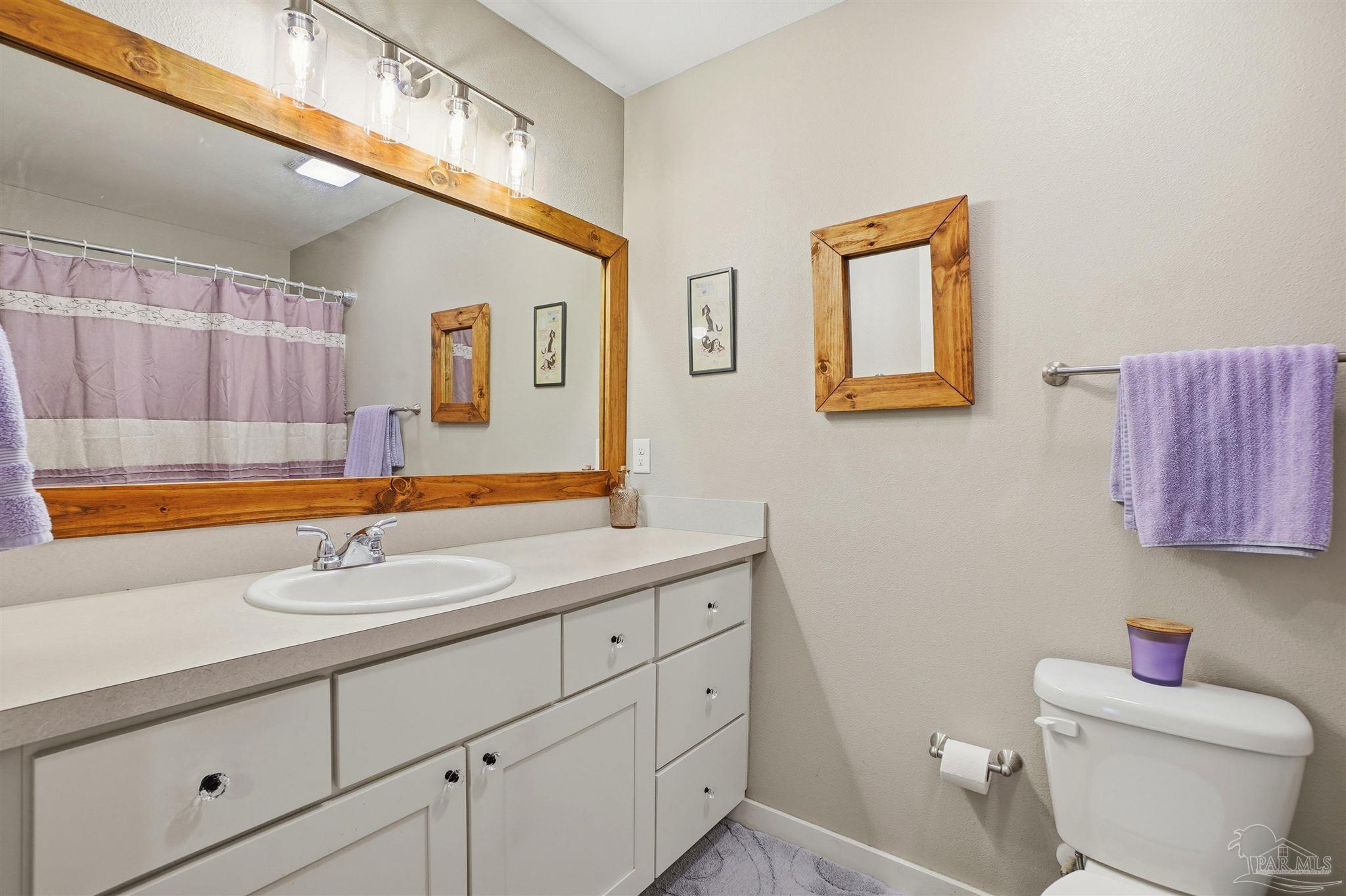 402 Front Street Century, FL 32535 - Photo 25 of 48 a bathroom with a sink and a mirror