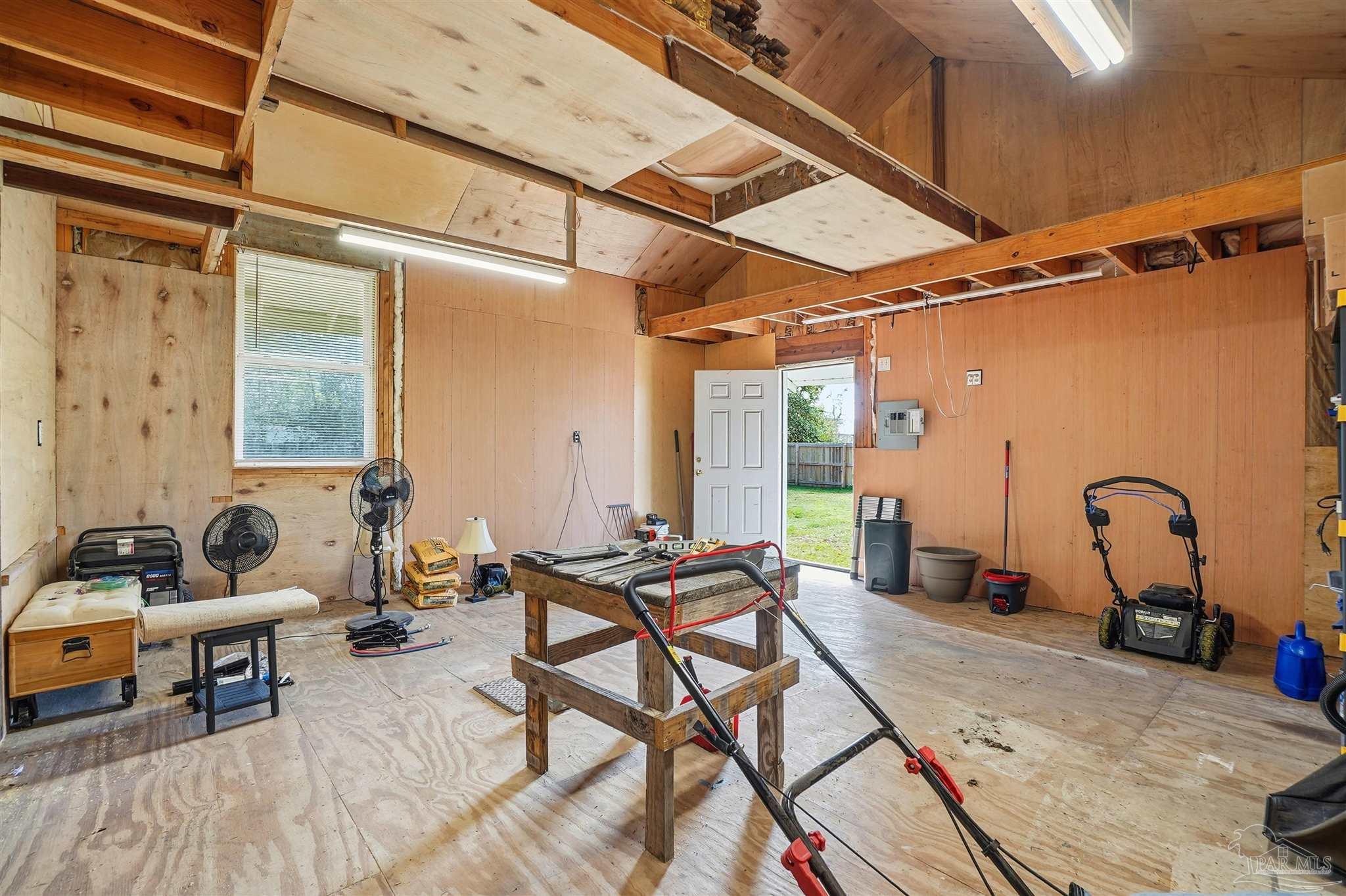 402 Front Street Century, FL 32535 - Photo 32 of 48 a outdoor space with lots of chairs and a couch