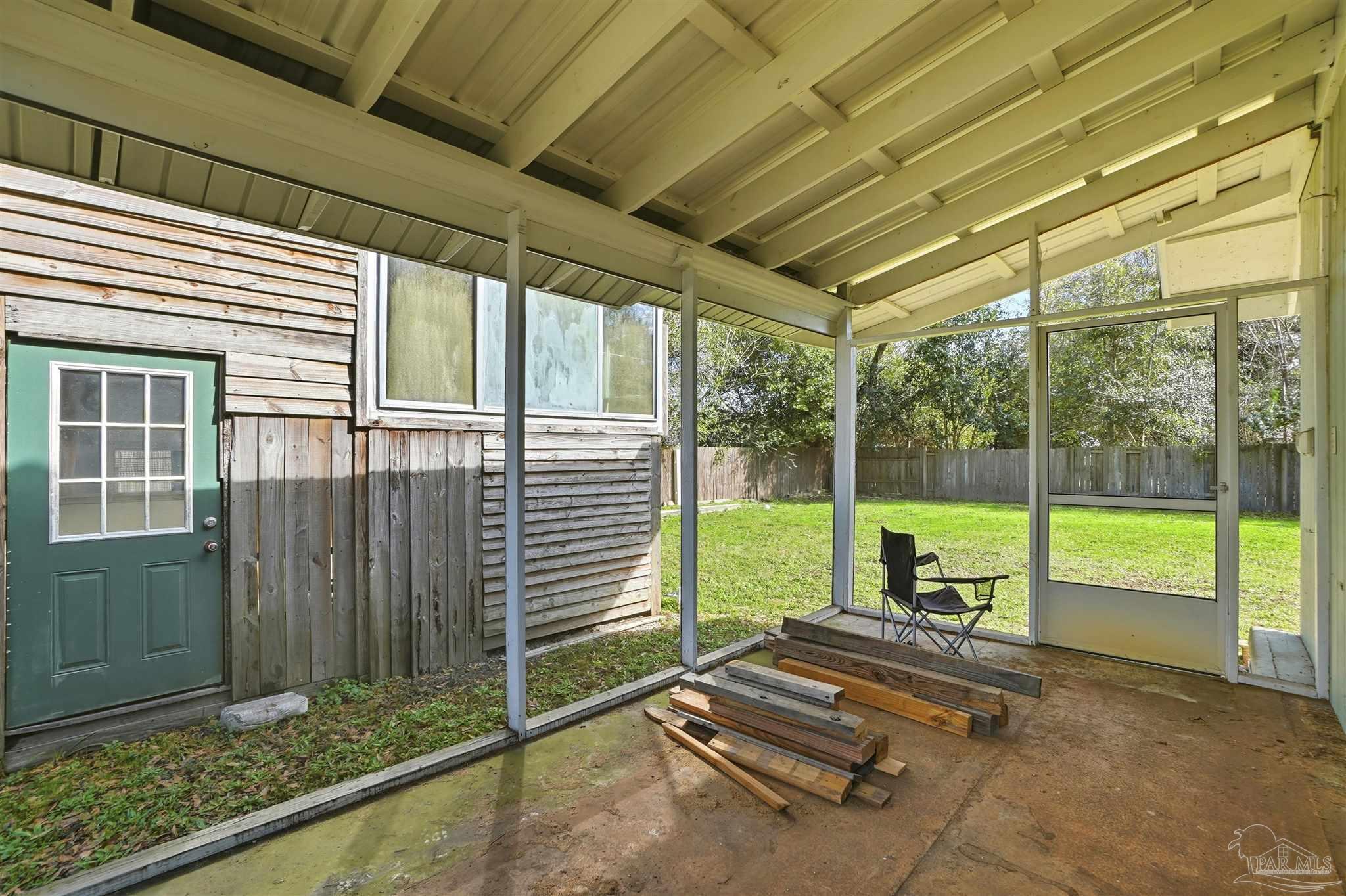402 Front Street Century, FL 32535 - Photo 33 of 48 a view of a room with wooden floor and windows