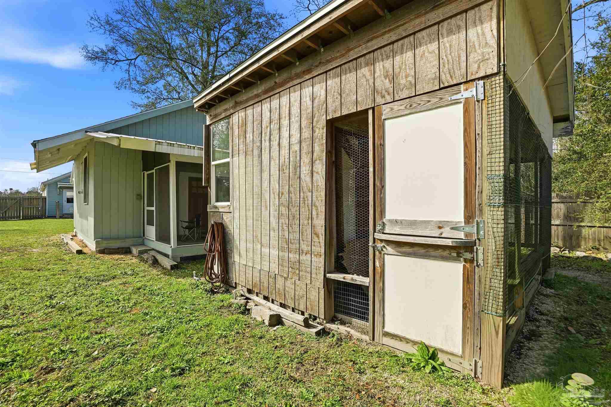402 Front Street Century, FL 32535 - Photo 38 of 48 a backyard of a house with table and chairs