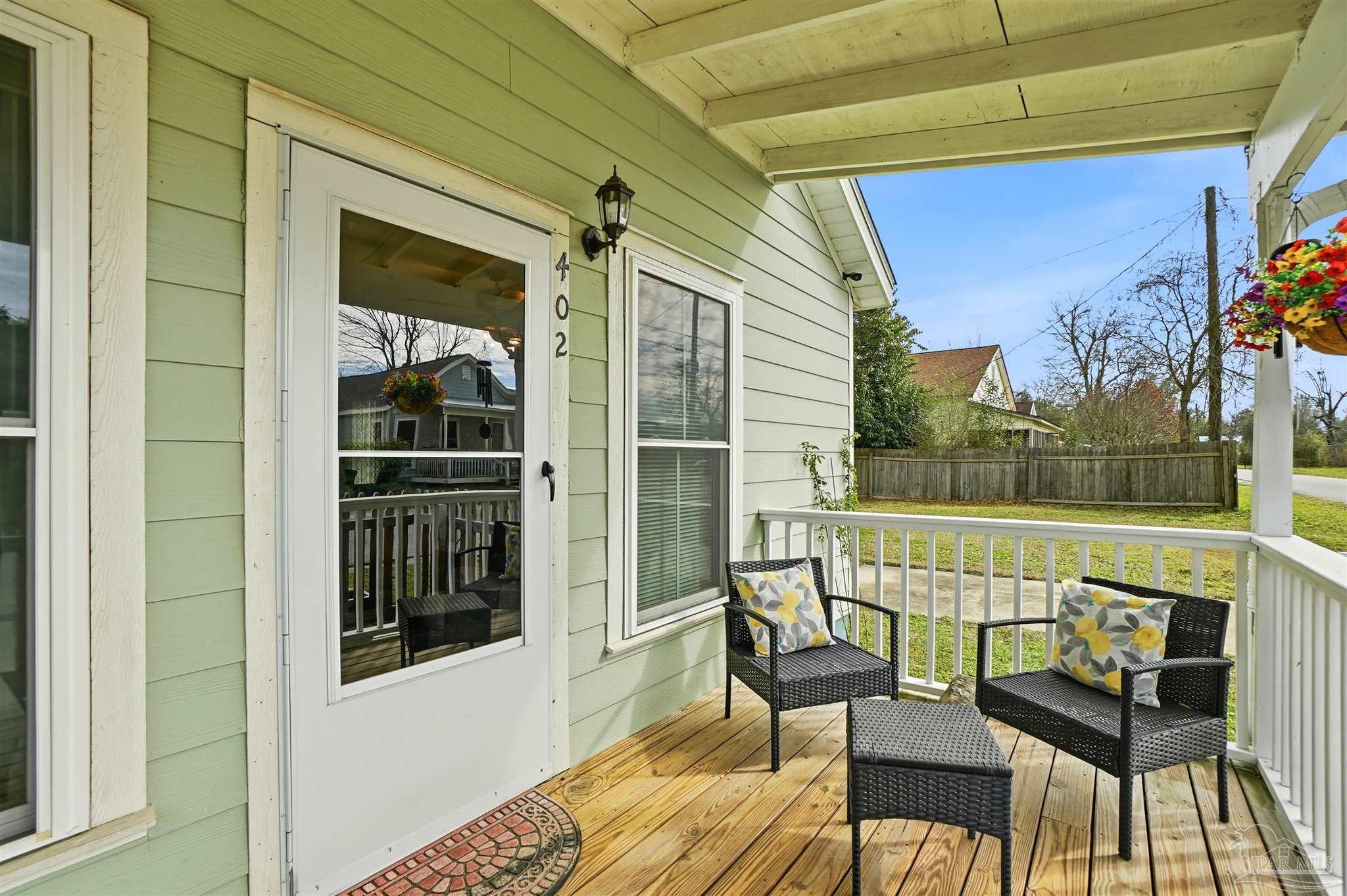 402 Front Street Century, FL 32535 - Photo 4 of 48 a view of a balcony with furniture