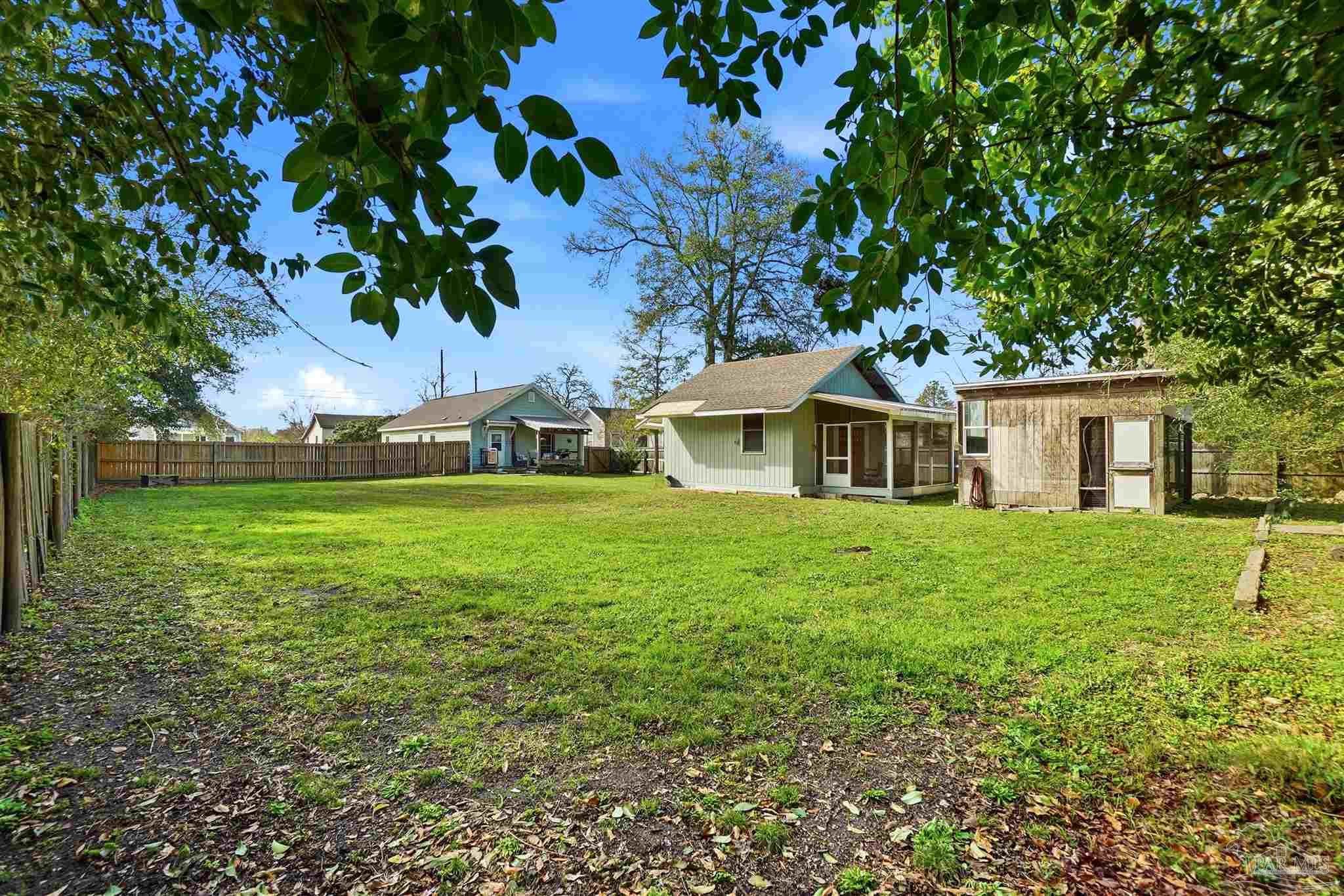 402 Front Street Century, FL 32535 - Photo 46 of 48 a front view of a house with garden
