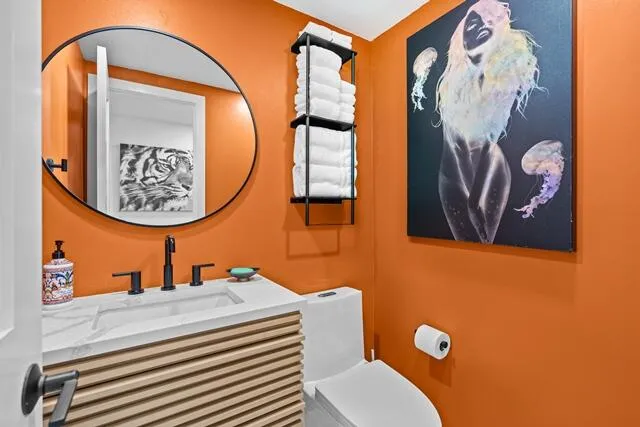 a bathroom with a toilet and a sink