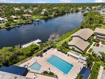 an aerial view of a house with a lake view