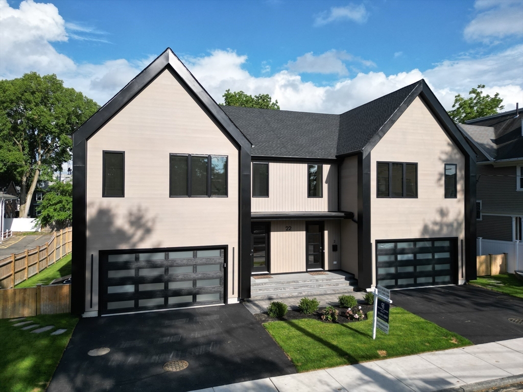 22 Appleton Street, Unit 1 Waltham, MA 02453 - Photo 1 of 36 a front view of a house with garden