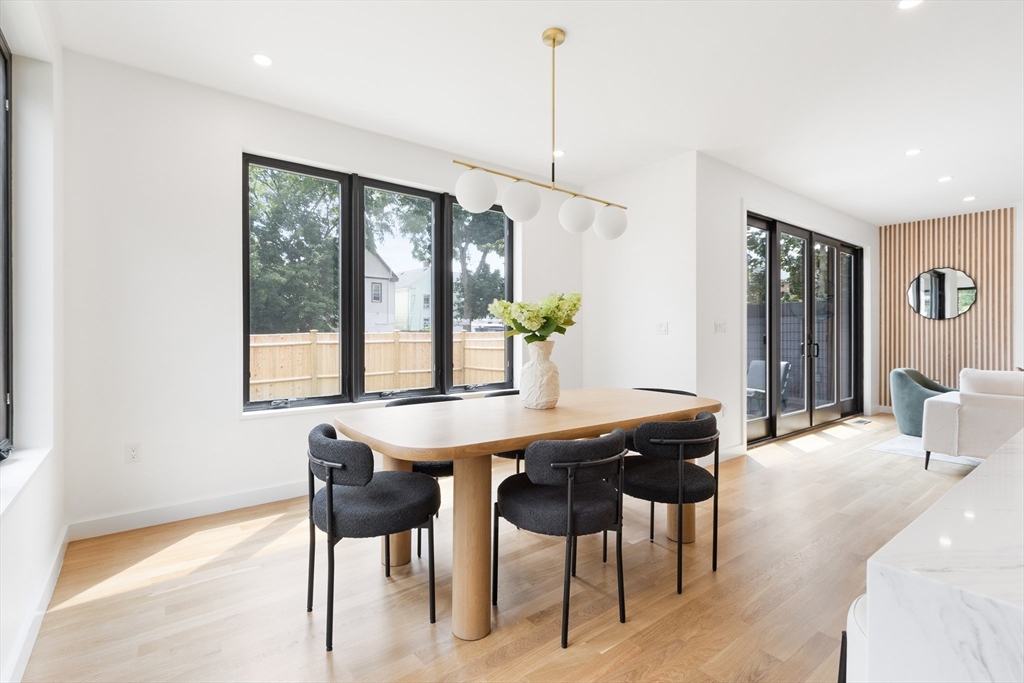 22 Appleton Street, Unit 1 Waltham, MA 02453 - Photo 11 of 36 a view of a dining room with furniture window and outside view