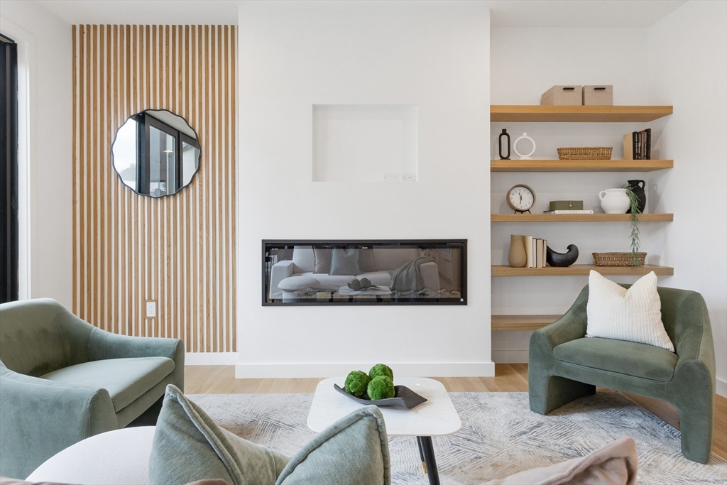 22 Appleton Street, Unit 1 Waltham, MA 02453 - Photo 12 of 36 a living room with furniture and a painting on the wall