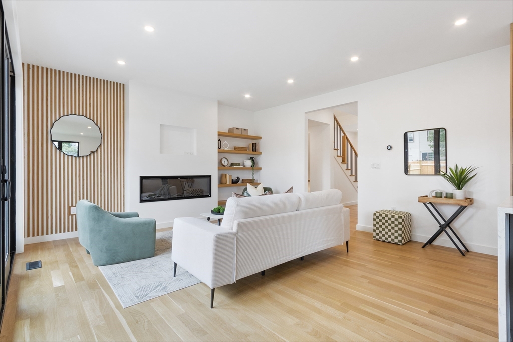 22 Appleton Street, Unit 1 Waltham, MA 02453 - Photo 13 of 36 a living room with furniture and a window