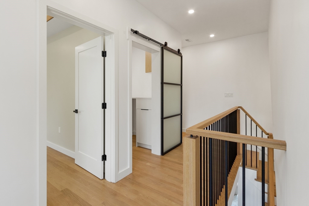 22 Appleton Street, Unit 1 Waltham, MA 02453 - Photo 15 of 36 a view of entryway with wooden floor