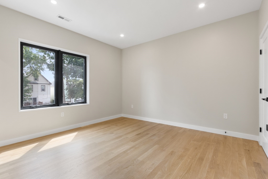 22 Appleton Street, Unit 1 Waltham, MA 02453 - Photo 23 of 36 a view of an empty room with a window