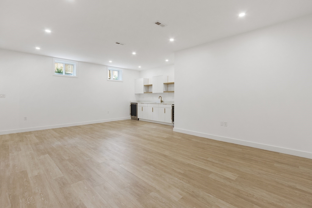 22 Appleton Street, Unit 1 Waltham, MA 02453 - Photo 29 of 36 a view of a kitchen with a sink and microwave