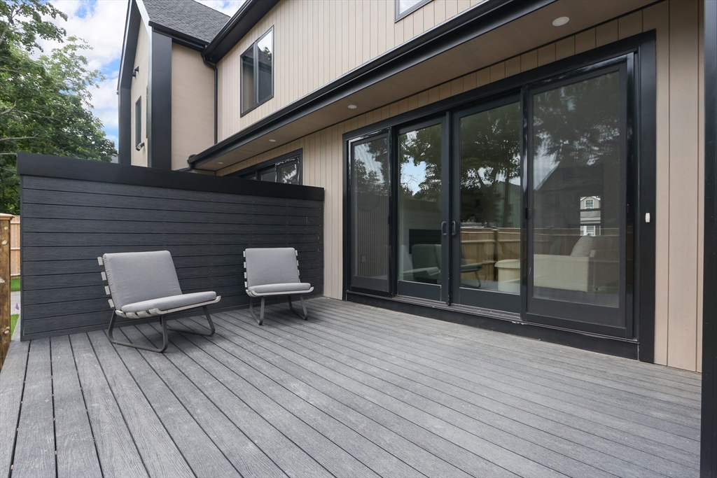 22 Appleton Street, Unit 1 Waltham, MA 02453 - Photo 32 of 36 a view of sitting area with furniture and wooden deck