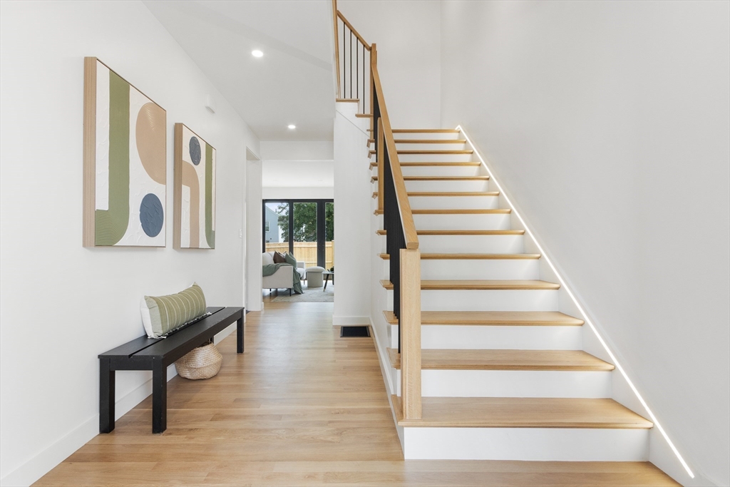 22 Appleton Street, Unit 1 Waltham, MA 02453 - Photo 5 of 36 a view of entryway and hall with wooden floor