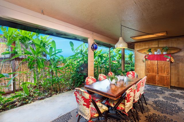 a outdoor dining space with furniture and outdoor view