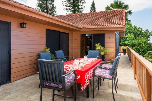 a view of a table and chairs in back porch