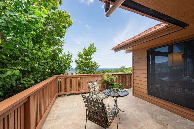 a view of balcony with wooden floor and outdoor seating