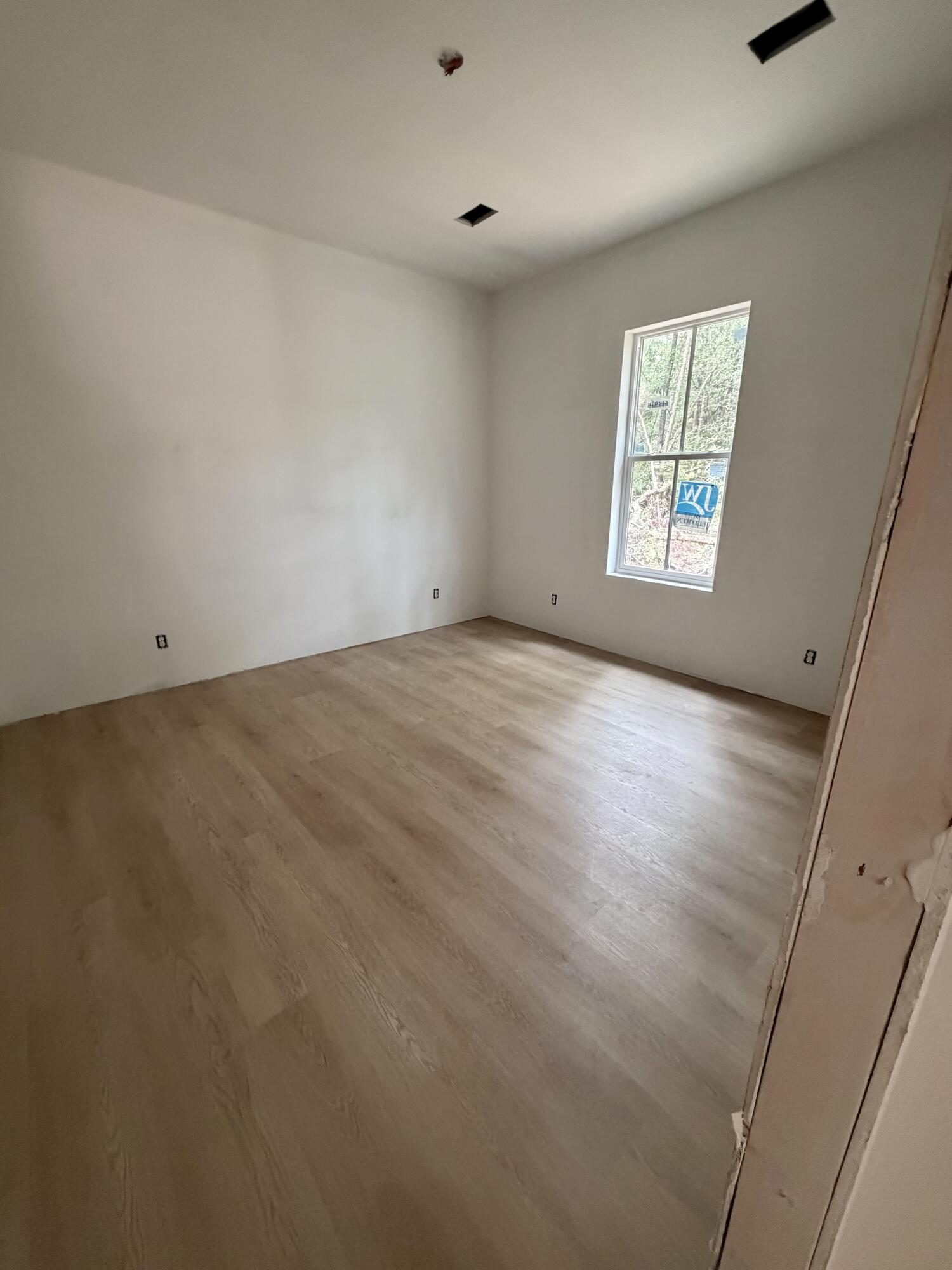 219 South J Hunter's Way, Unit LOT 73 Freeport, FL 32439 - Photo 10 of 10 an empty room with windows