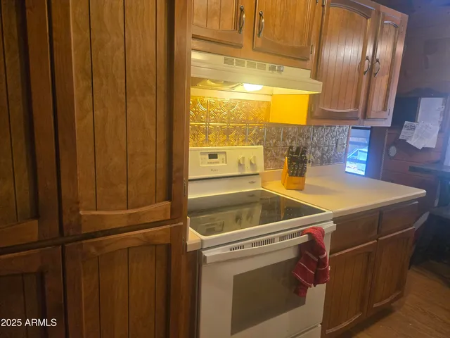 a living room with furniture a window and a table