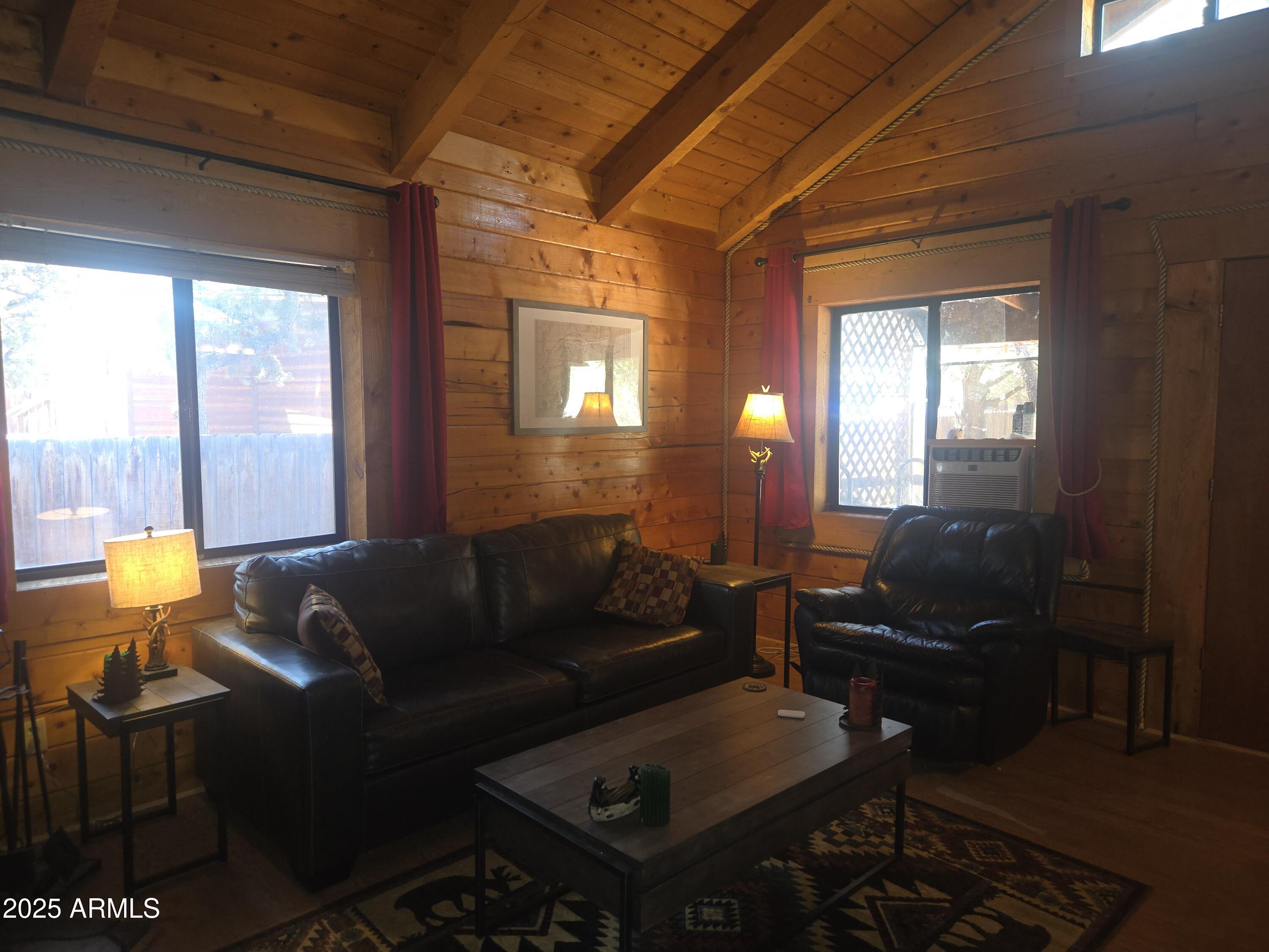 2145 Fishermans Road Overgaard, AZ 85933 - Photo 14 of 28 a living room with furniture and a window