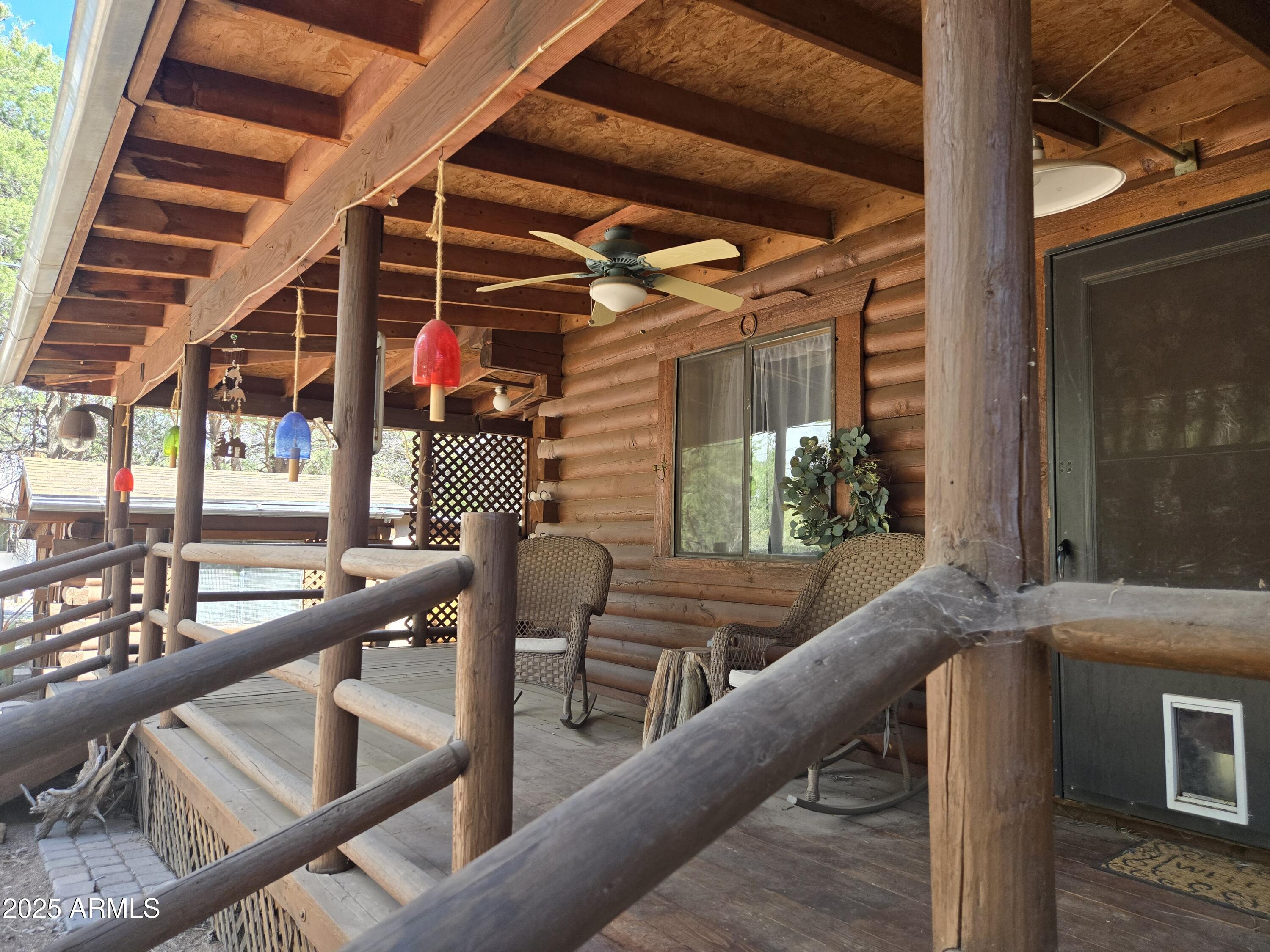2145 Fishermans Road Overgaard, AZ 85933 - Photo 2 of 28 a roof deck with couches and wooden floor