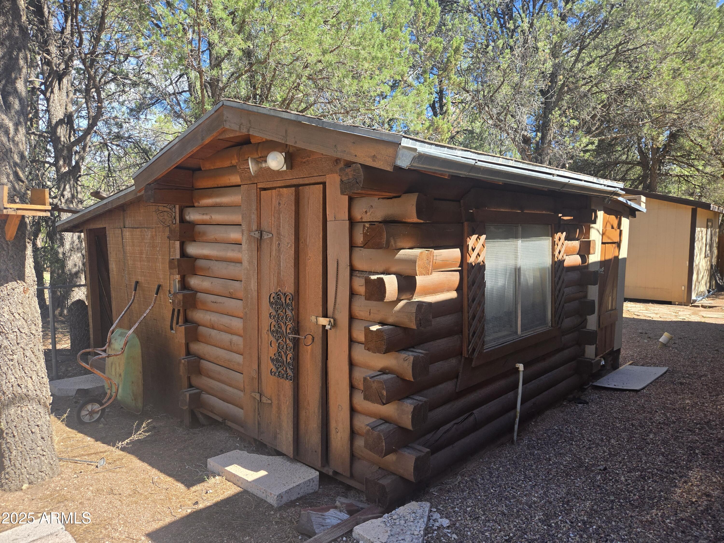 2145 Fishermans Road Overgaard, AZ 85933 - Photo 23 of 28 a front view of a house with a yard