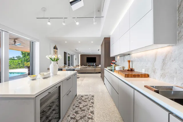 a large kitchen with a stove and a sink