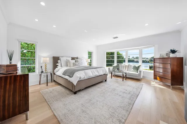 a spacious bedroom with a bed and a couch