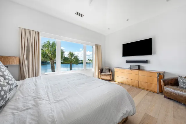 a bathroom with a sink a large mirror and shower