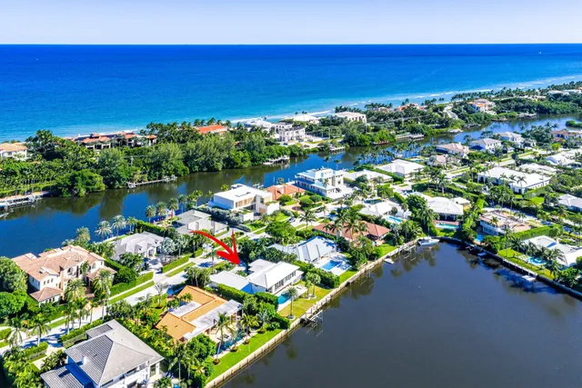 a front view of a house with a yard and a garage