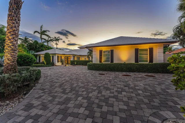 a view of a swimming pool with a lawn chairs