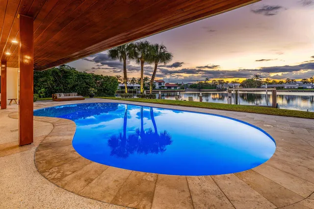 a view of swimming pool with seating space