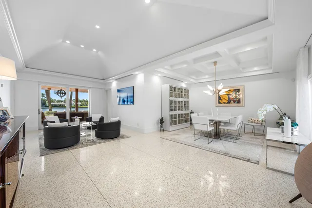 a living room with furniture a couch and a window