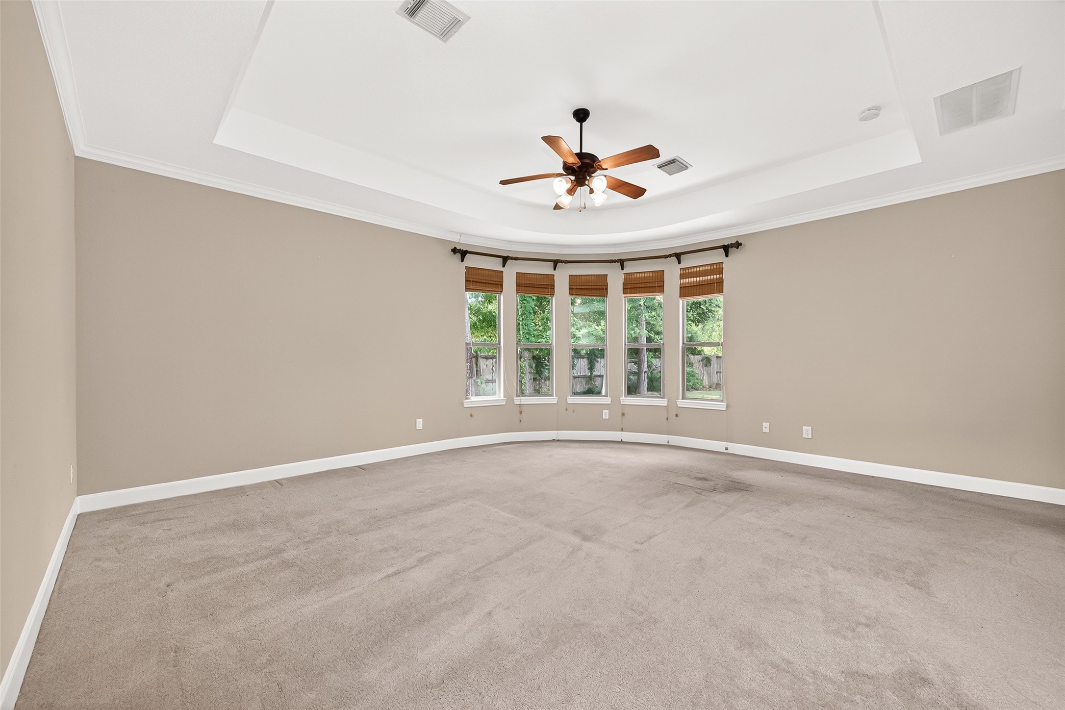 2310 Spring Lake Park Lane Spring, TX 77386 - Photo 36 of 47 an empty room with a window and a ceiling fan