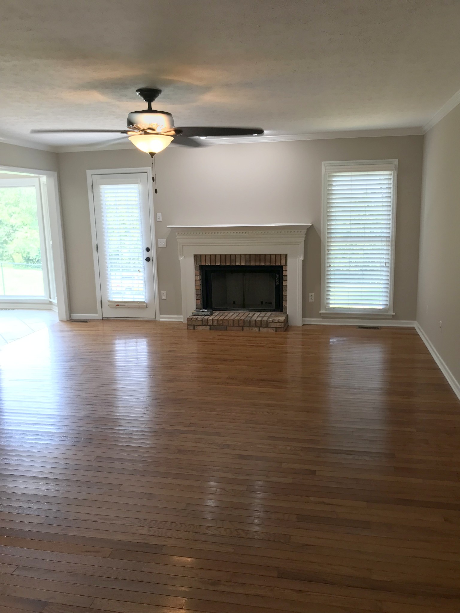 307 Clearview Drive Springfield, TN 37172 - Photo 8 of 33 a view of empty room with wooden floor and fireplace