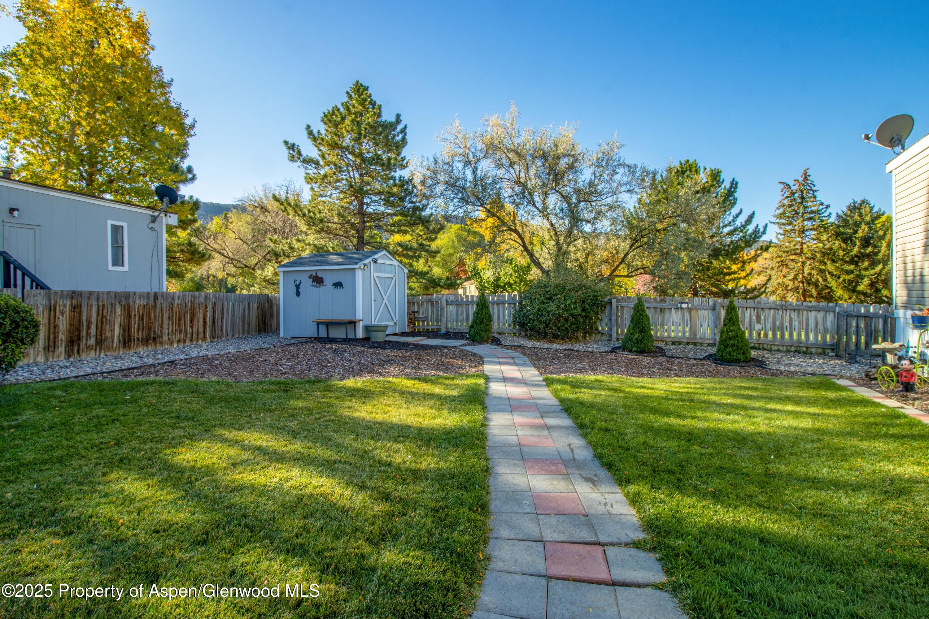 116 Iron Wedge Circle Parachute, CO 81635 - Photo 3 of 20 a swimming pool with outdoor seating and yard
