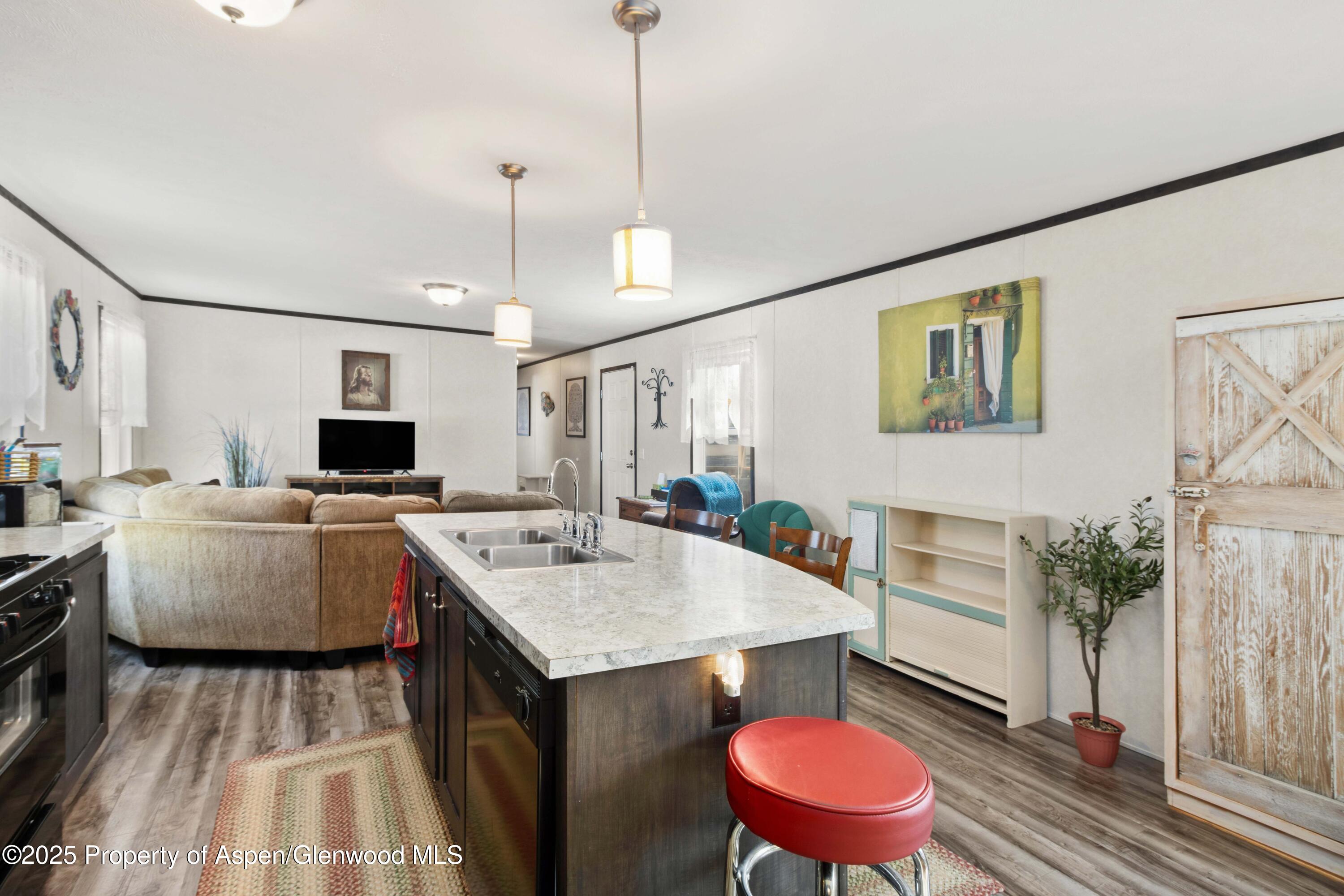 116 Iron Wedge Circle Parachute, CO 81635 - Photo 5 of 20 a view of kitchen with a sink and breakfast area
