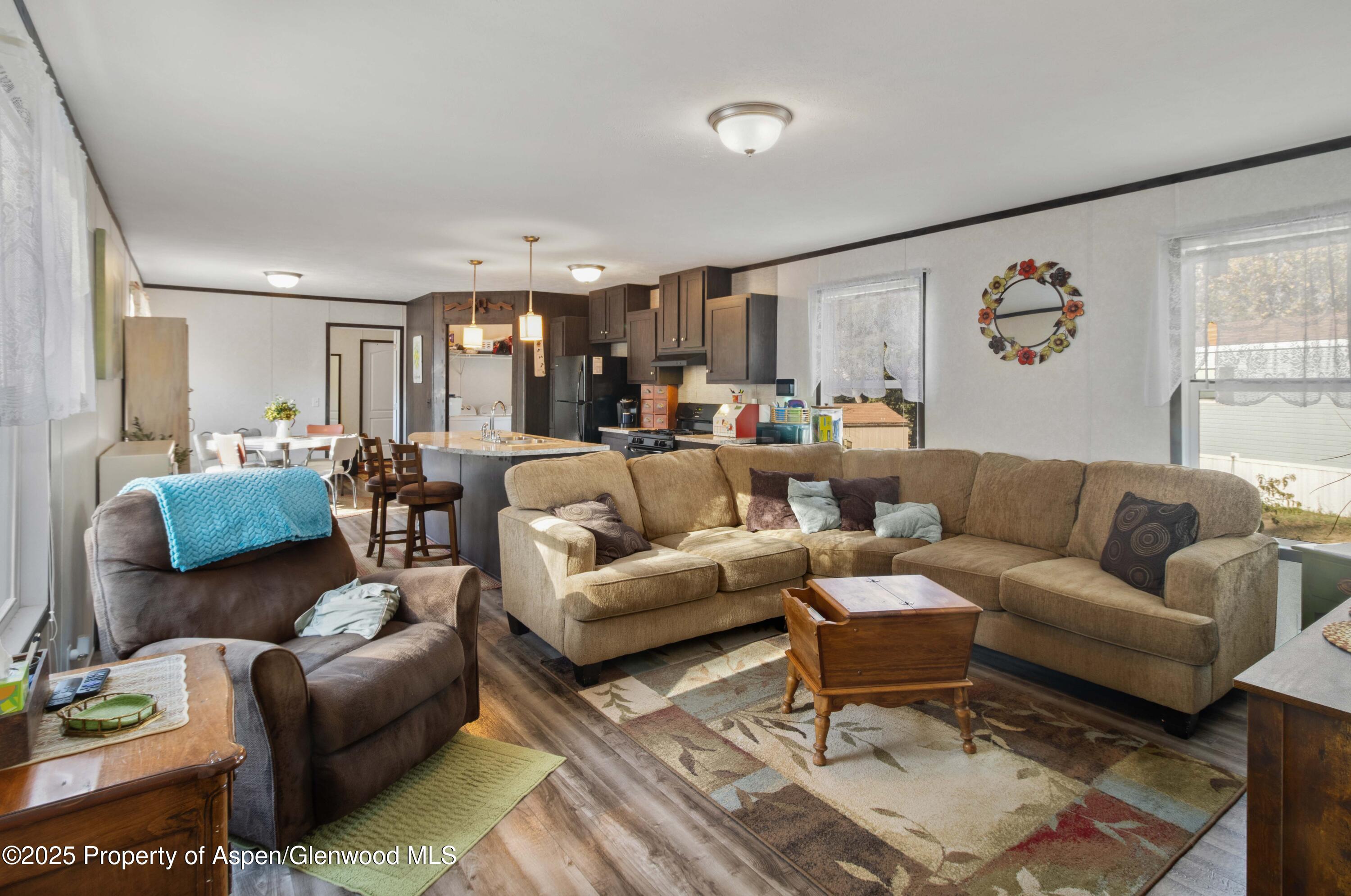 116 Iron Wedge Circle Parachute, CO 81635 - Photo 6 of 20 a living room with furniture and a large window
