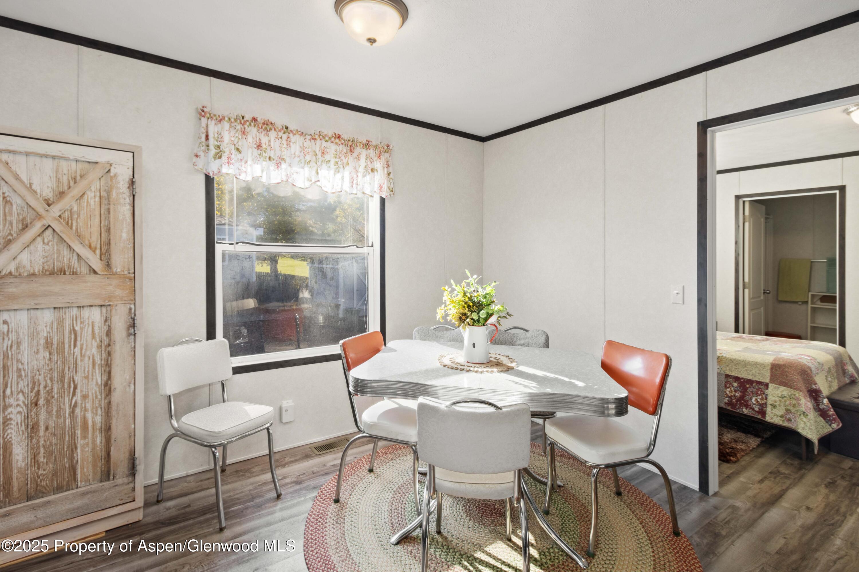 116 Iron Wedge Circle Parachute, CO 81635 - Photo 8 of 20 a dining room with furniture and window